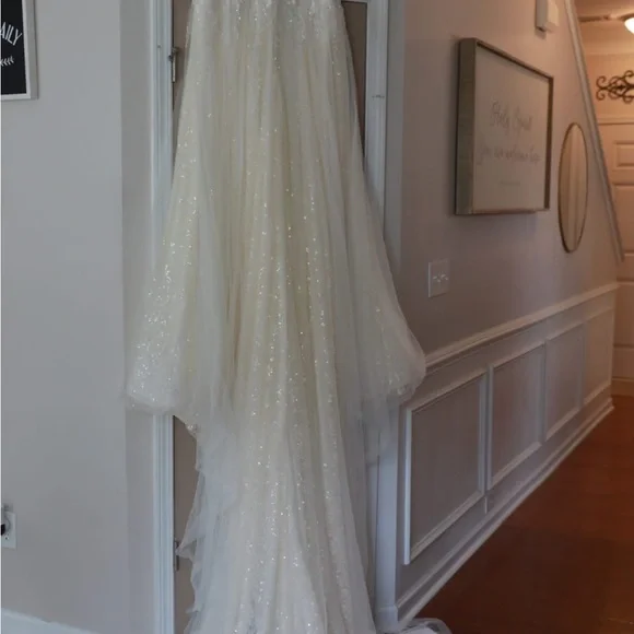 This wedding dress is a size 20. Brand New and had never been worn before.